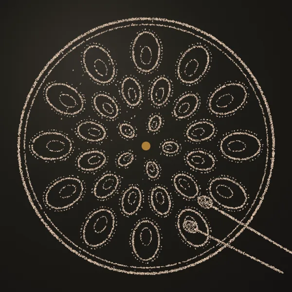 Steelpan drawn in sand on a dark metal plate