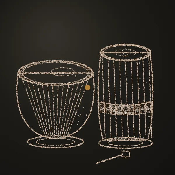 Tabla drawn in sand on a dark metal plate